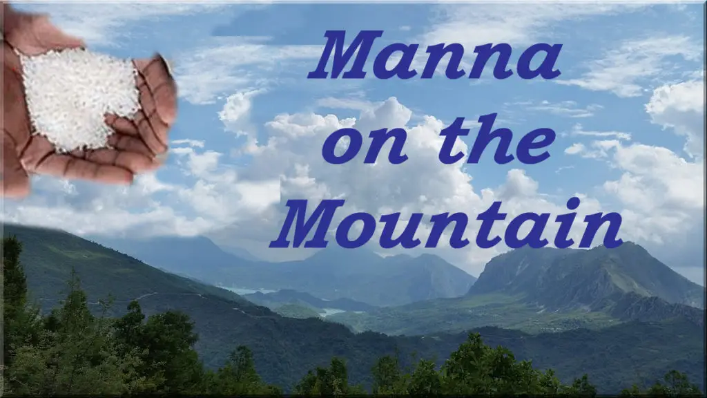 hand holding manna above mountains